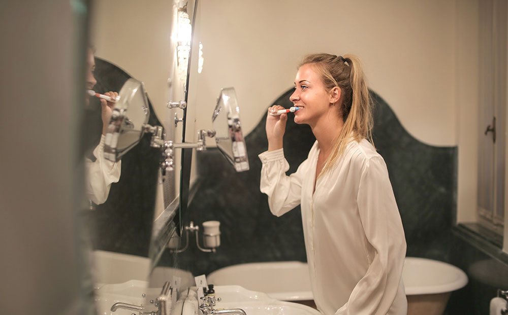 Woman brushing her teeth