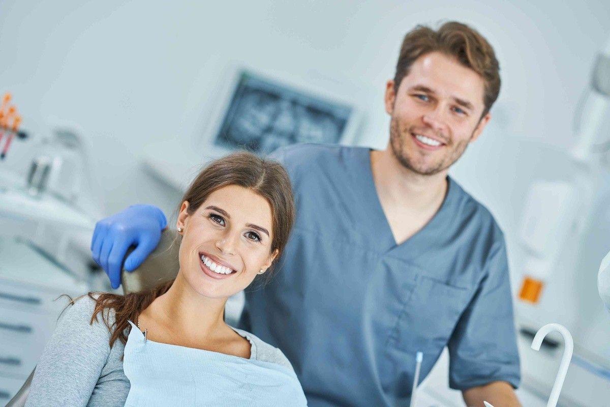 Patient smiling with dentist during a dental visit in a dental office