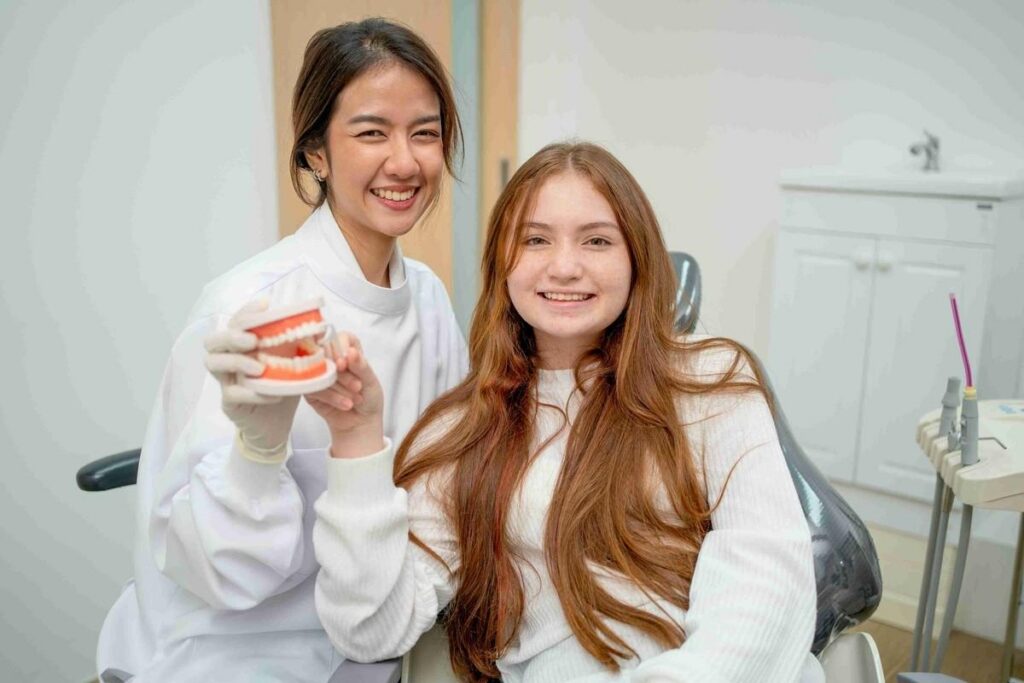 Dentist and patient discussing dental implant options in a modern dental office