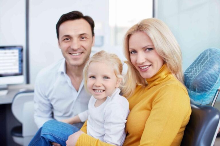 Parents with a child at dental office for family dental care